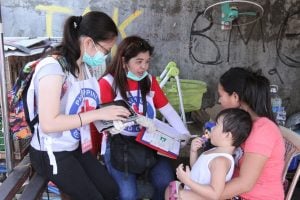 PRC volunteers visit communities to educate the public on measles and other common diseases.