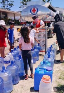 Philippine Red Cross gives clean water to TY Odette affected families