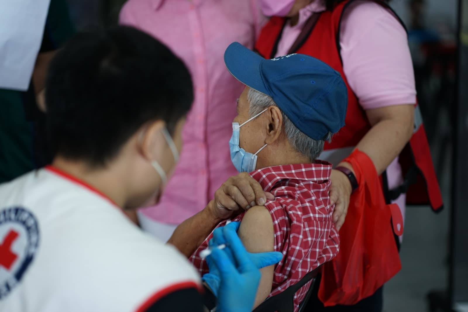 Diabetes patient Nicanor Viray, 85 years old, gets his Covid-19 second booster shot at the Philippine Red Cross.