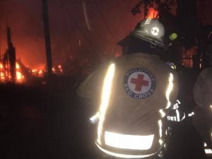 Red Cross volunteer firefighters responding to a fire in BASECO MANILA