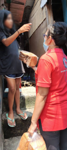 Philippine Red Cross distributes loaves of bread to flood victims in Malabon