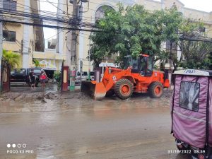 Philippine Red Cross payloader clearing mud debris in Sta.Rosa Laguna
